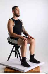 Whole Body Man White Sports Shorts Slim Athletic Sitting Top Studio photo references